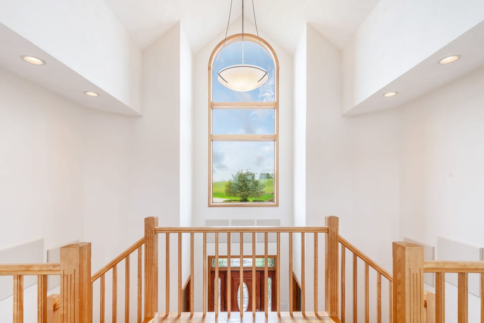 Second story cat walk overlooking the two story foyer.