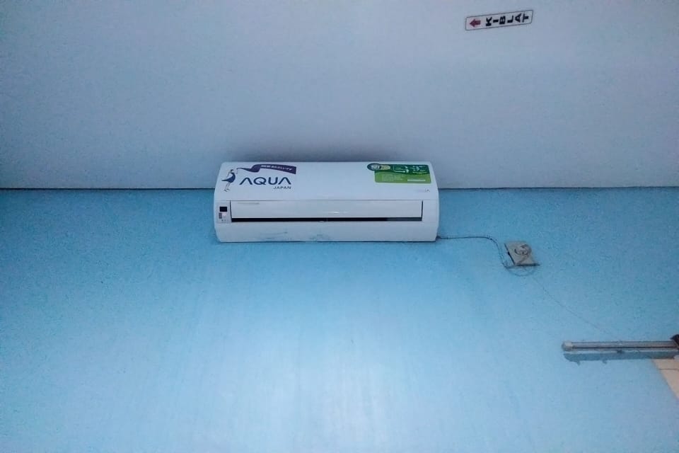 Desk, laptop workspace, bed sheets