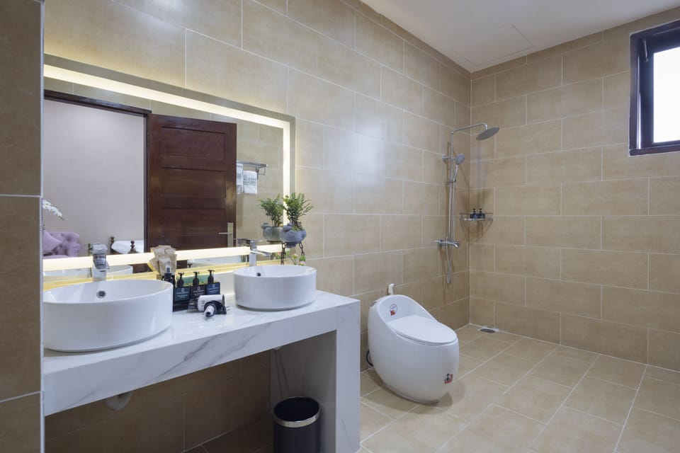 Family Room, Multiple Beds, Garden View | Bathroom | Shower, hydromassage showerhead, hair dryer, bathrobes