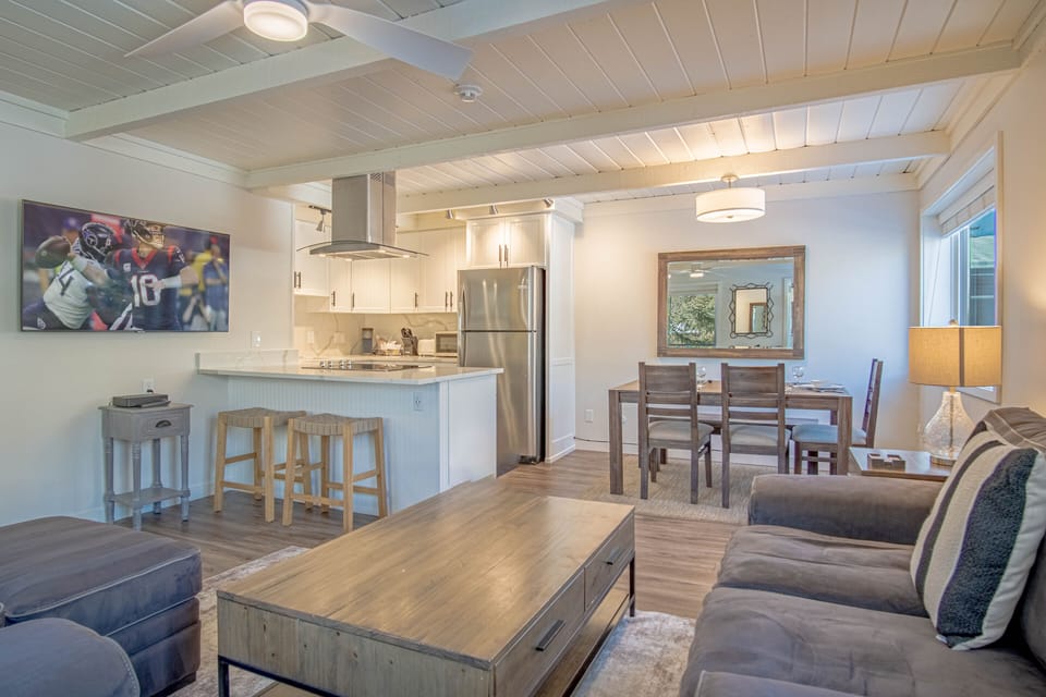 Open plan living room with brand-new kitchen and dining area