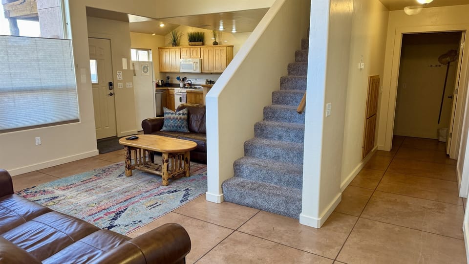 Hallway to the right of the stairs leads to the master suite