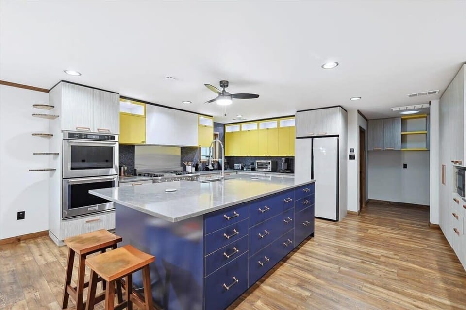Unique and unlike any other kitchen, the contrasting yellow and blue create a modern, sophisticated culinary space for you to unleash your inner chef.