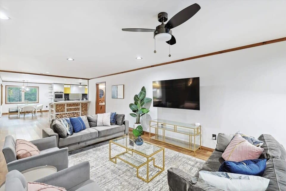 Tastefully furnished with your comfort in mind, this living room features comfortable couches and sofas to create a cozy environment for you to enjoy your time.