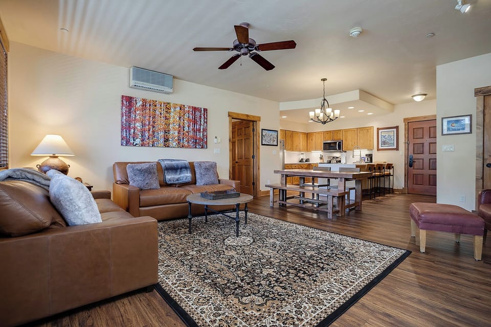 Relax in your spacious living area with comfortable leather seating, then prepare meals in your fully equipped kitchen with modern appliances.