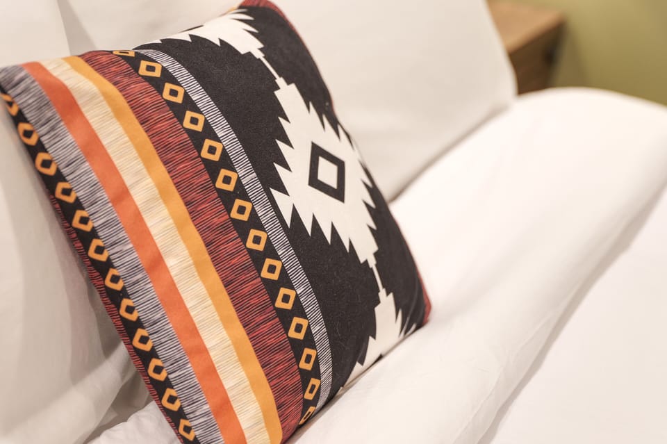 Crisp White linens, plump pillows and comforters