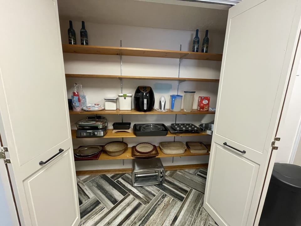 Large pantry with air fryer, food steamer, Pampered Chef bakeware, room for food