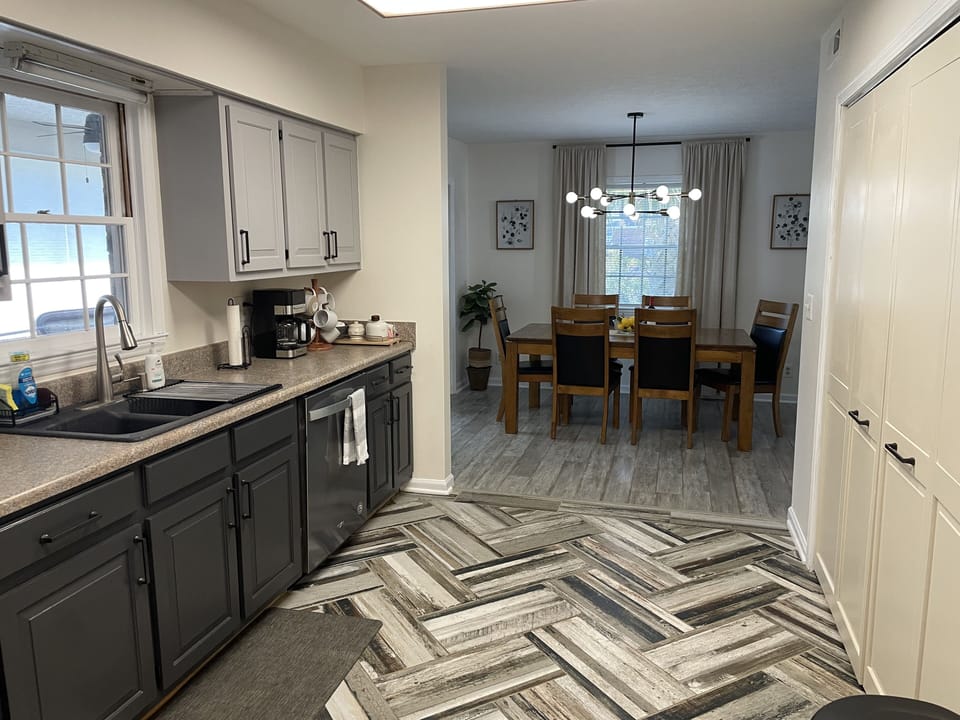 Kitchen open to dining room, and window to Carolina room