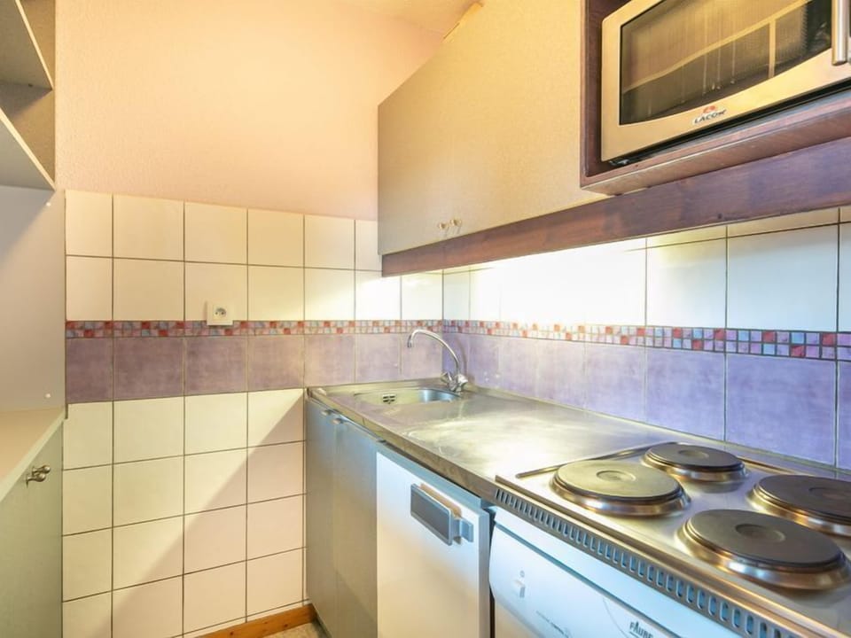 Prepare a meal in the equipped kitchen.