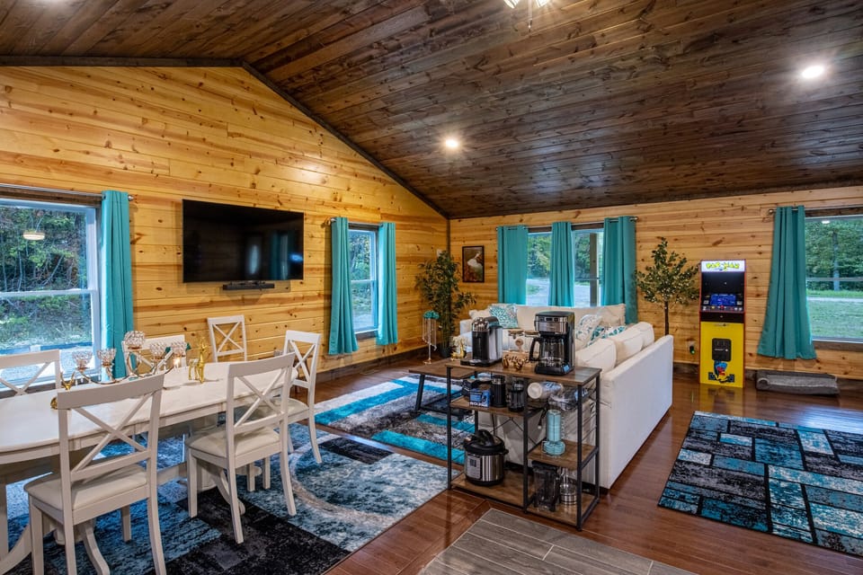 Inside, there is a large, open living area with vaulted ceilings