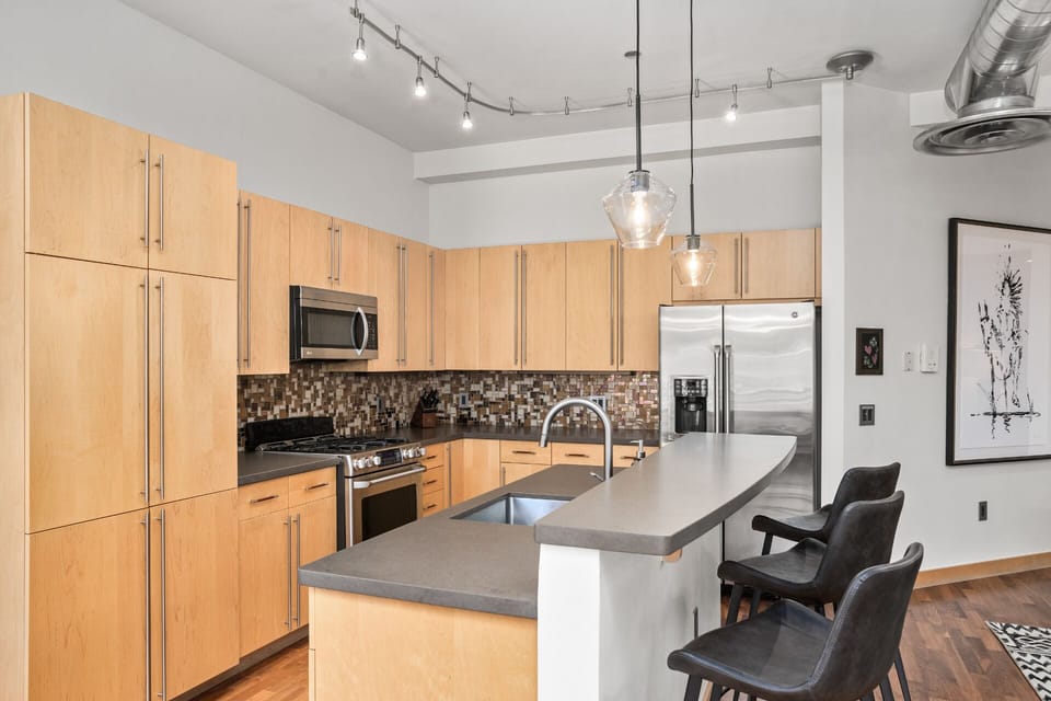 Fully Equipped Kitchen with Light Wood cabinetry