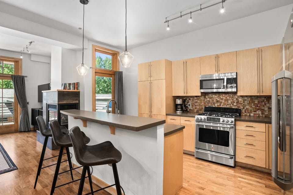 Two-tiered Kitchen Island with Bar Seating - 3 Modern Bucket Seat Stools