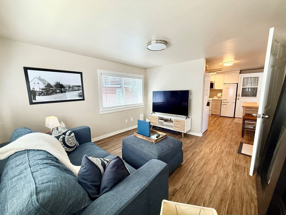 Cozy living area with Smart TV, books, and space to relax after exploring.