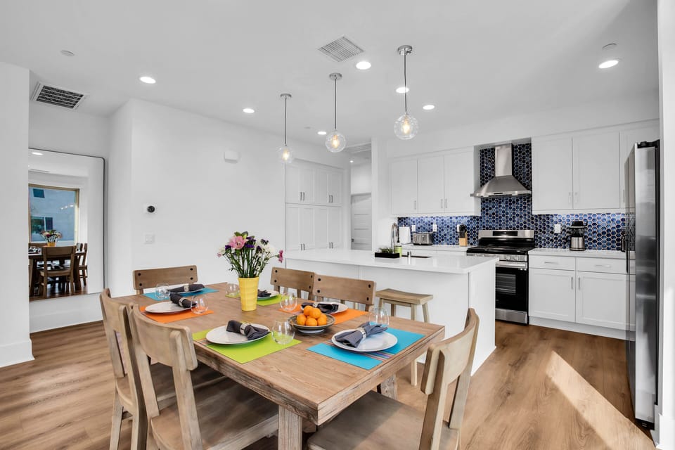 Dining table with seating for 6 with additional barstool seating for 3.