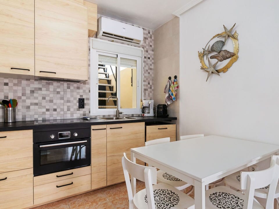 Furniture, Kitchen, Interior Design, Countertop, Cabinetry, Flooring, Major Appliance, Wood, Kitchen Appliance, Floor