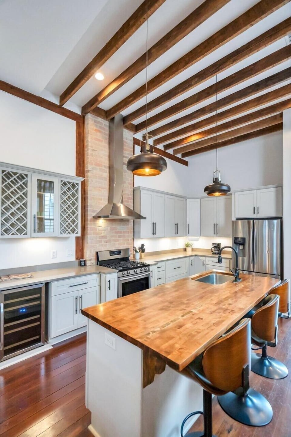 Spacious kitchen w/ island bar seating — perfect for group meals.
