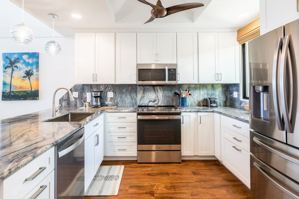 Prepare your favorite island dishes with upgraded appliances and a well-stocked kitchen