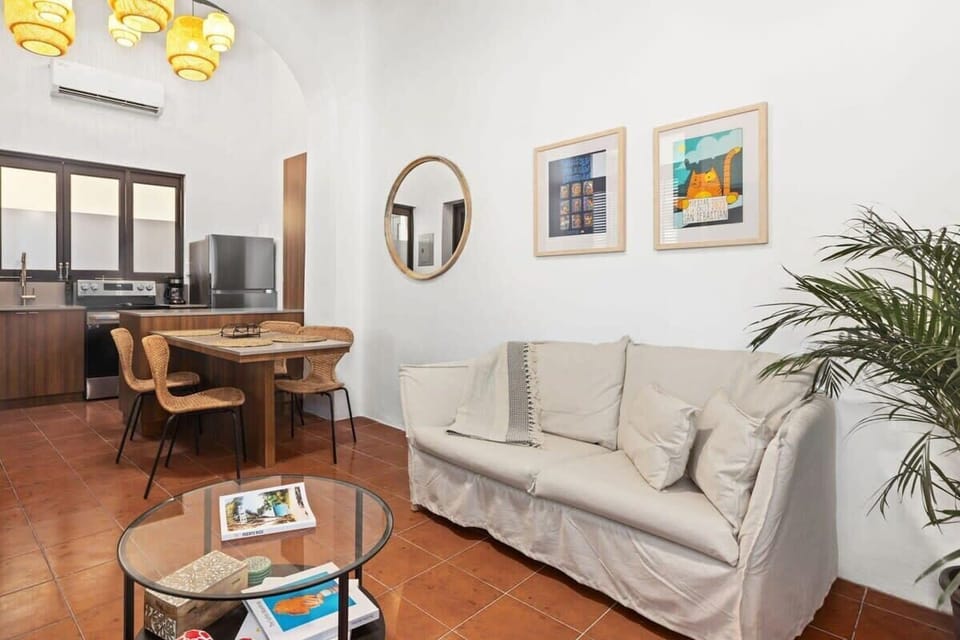 The living room is adjacent to the kitchen and dining area. Perfect to cook and socialize after a day exploring the city.