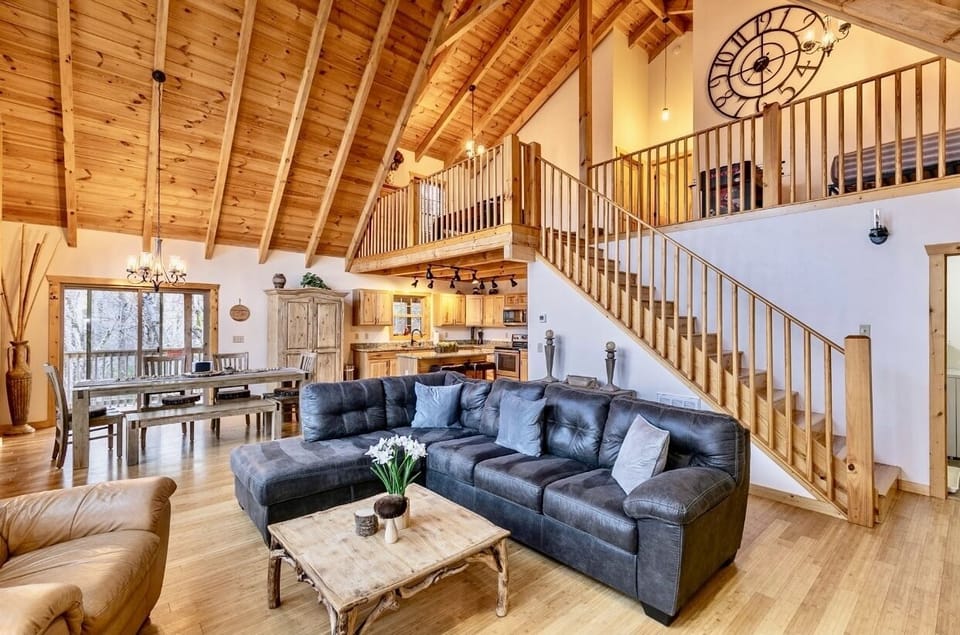 Open concept living room leading to 2nd floor loft and 2 additional bedrooms 