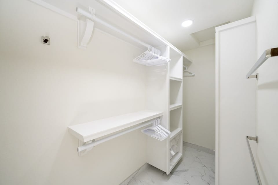 Guest suite includes a spacious walk-in closet—perfect for extended stays or unpack-and-relax living.