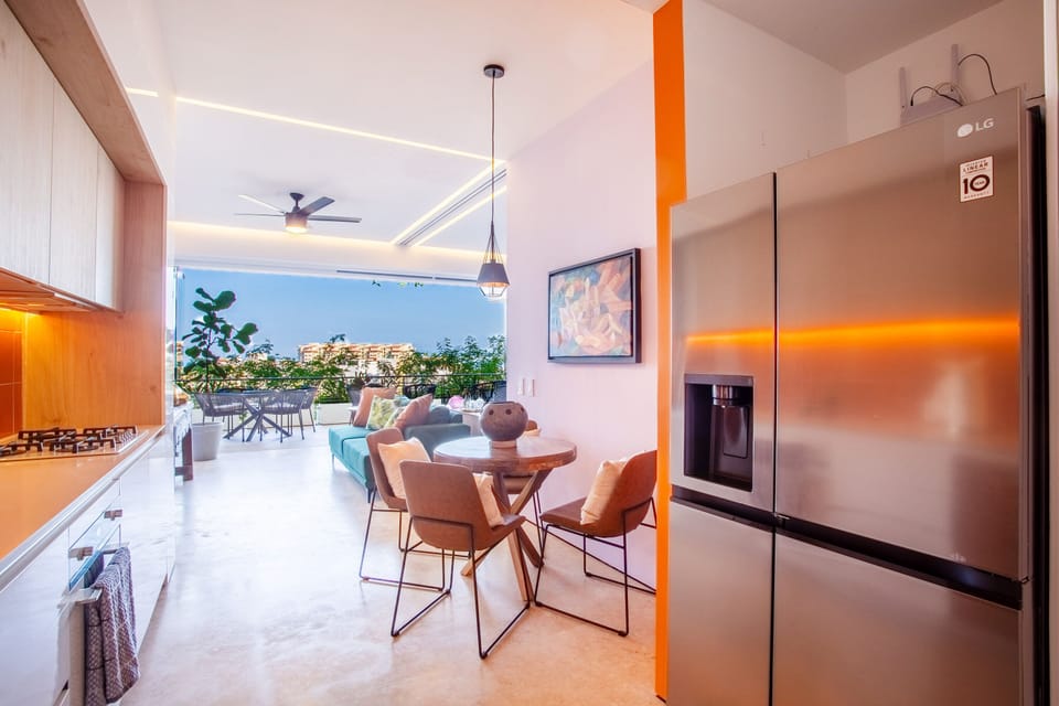 The kitchen includes a full-size refrigeator, stove, oven and dishwasher