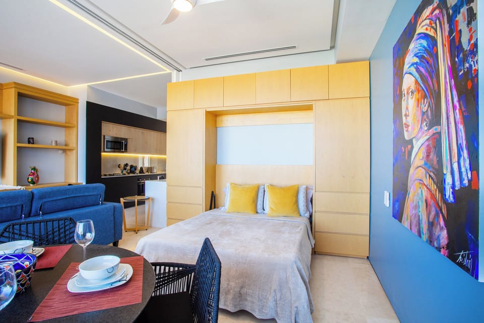 The second bedroom features a queen-size murphy bed and a sliding door to add privacy