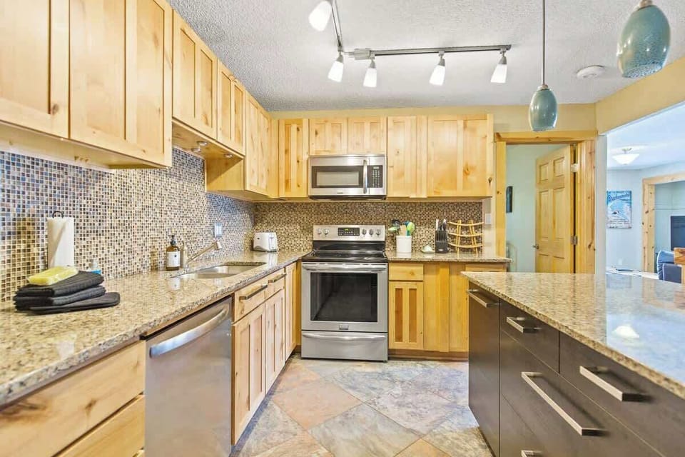 Kitchen with all stainless steel appliances