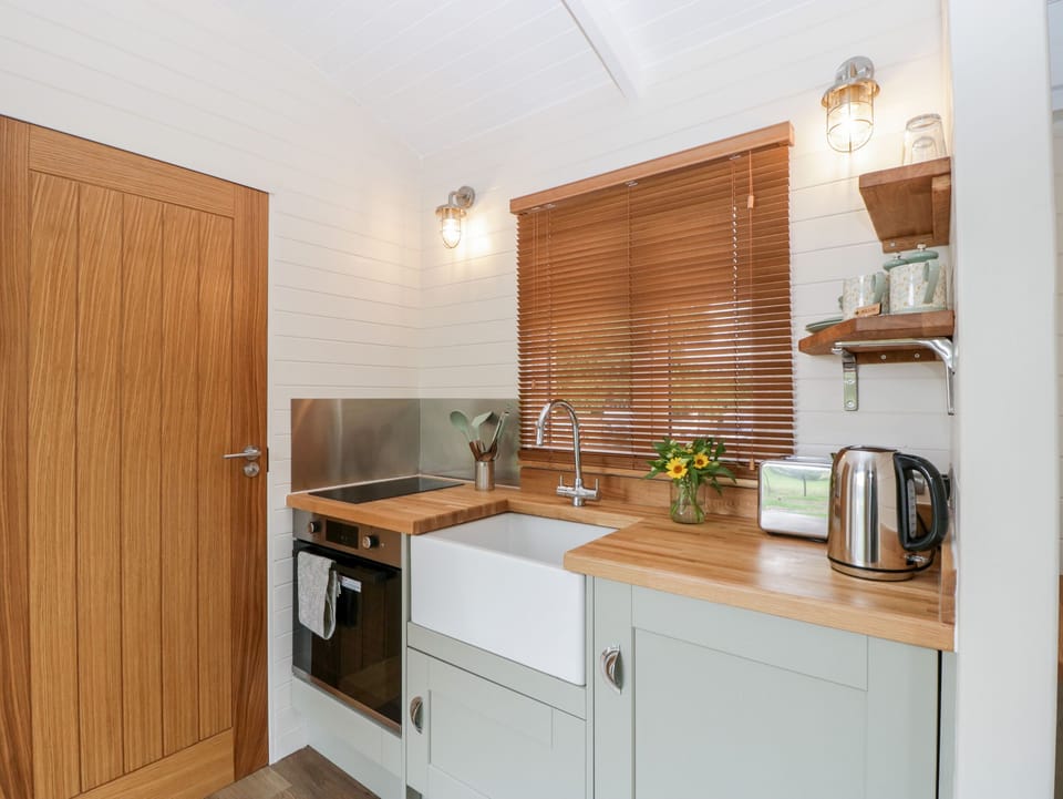 Fridge, electric kettle, toaster, cookware/dishes/utensils