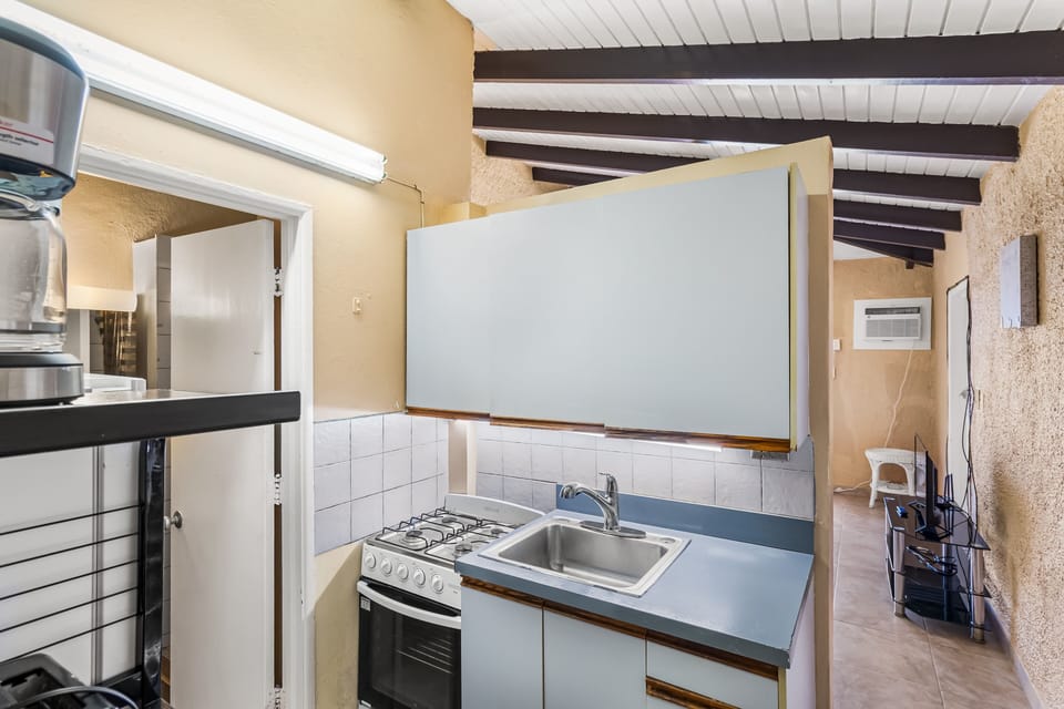 One complete condominium with all the furnishings and comforts. Your balcony overlooks the eighth-foot pool just a few feet from your doorstep. There are restaurants that specialize in local, Latin, and Caribbean food within walking distance—plenty of free onsite parking.