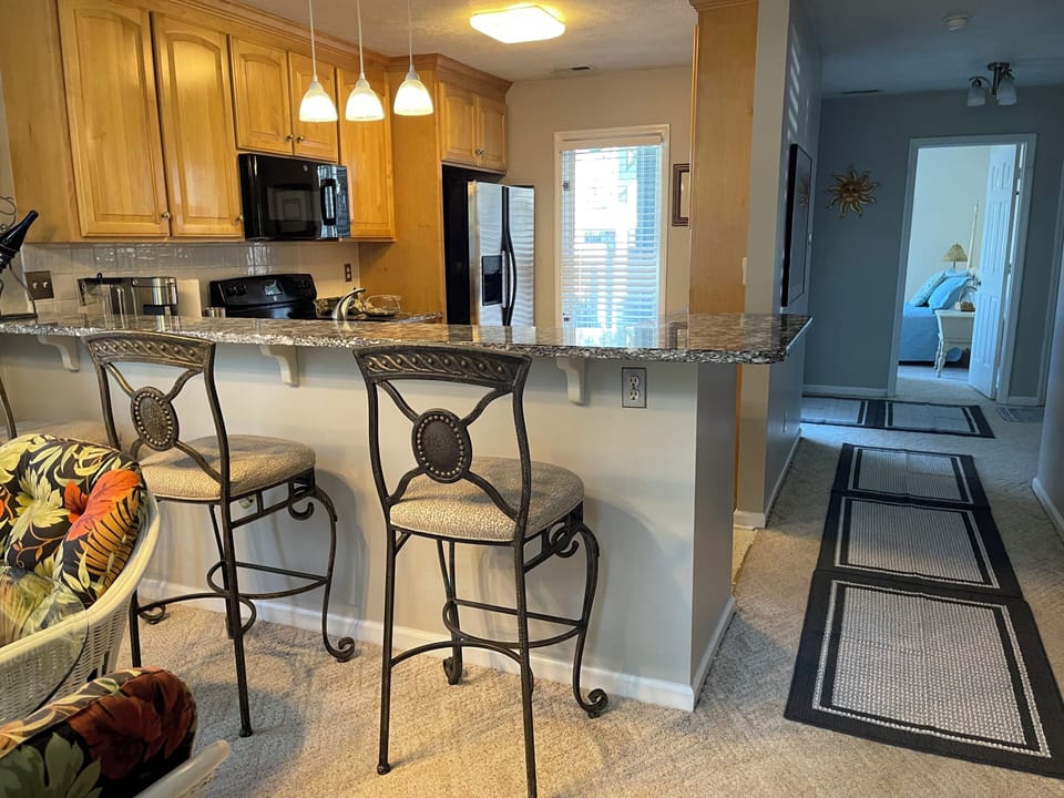 KITCHEN  & HALL:  HIGH BAR with chairs