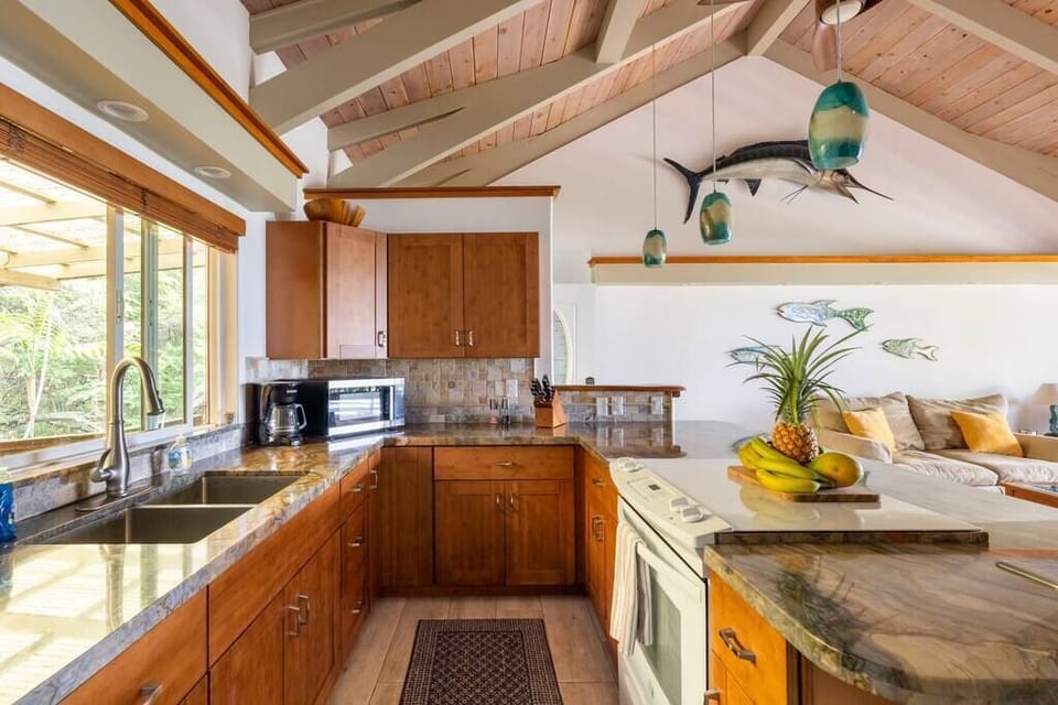 Fully equipped kitchen. Grills available on the pool deck as well. 