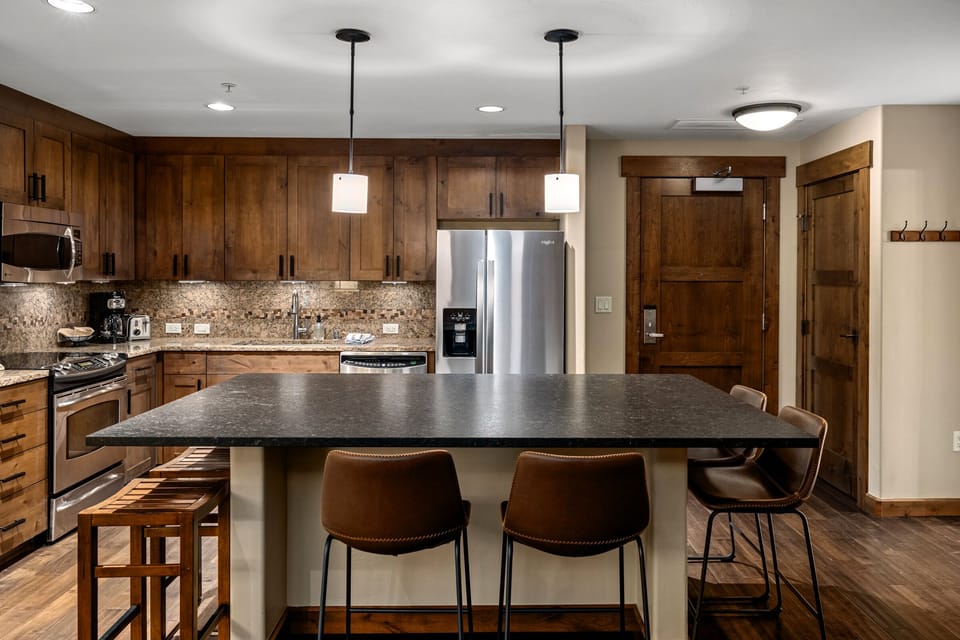 The owners upgraded the island bar top to be the dining table, and there is no separate dining table.