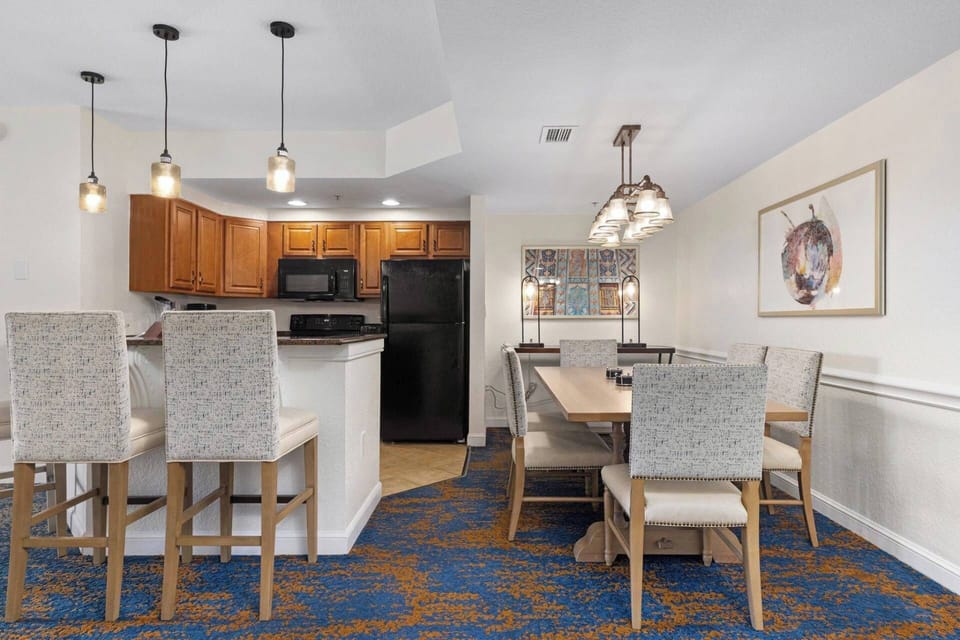 Full Kitchen and separate dining area with a large table for six.