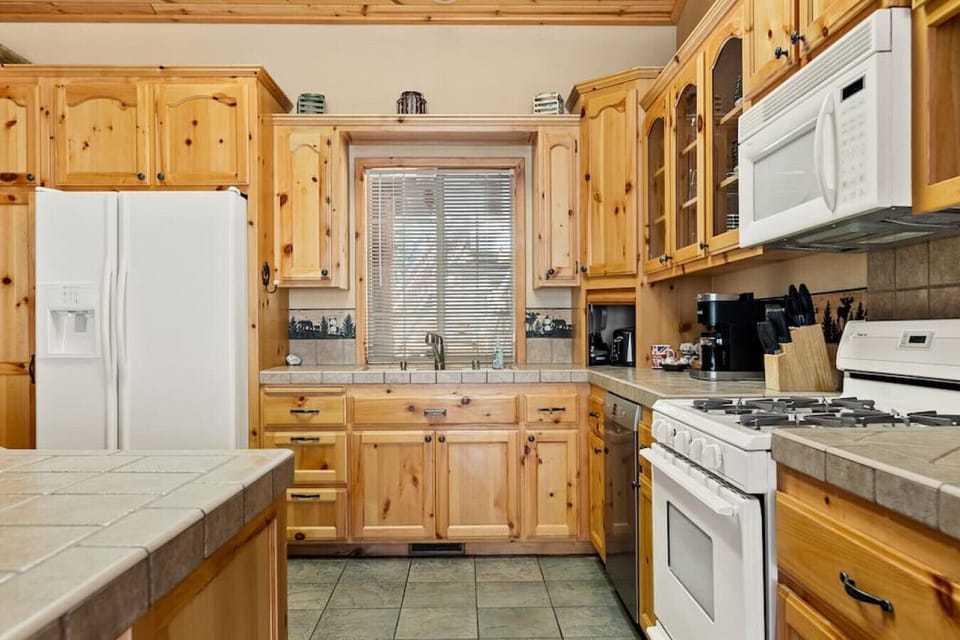 Kitchen features a Keurig Duo along with coffee, cream and sugar for your stay.