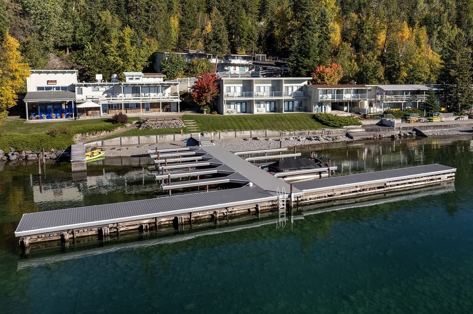 The resort dock reaches out over the clear water of Yellow Bay.