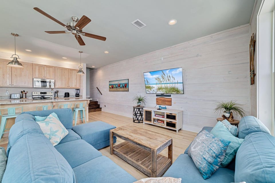 Soft recessed lighting and a ceiling fan provide added ambience and comfort.