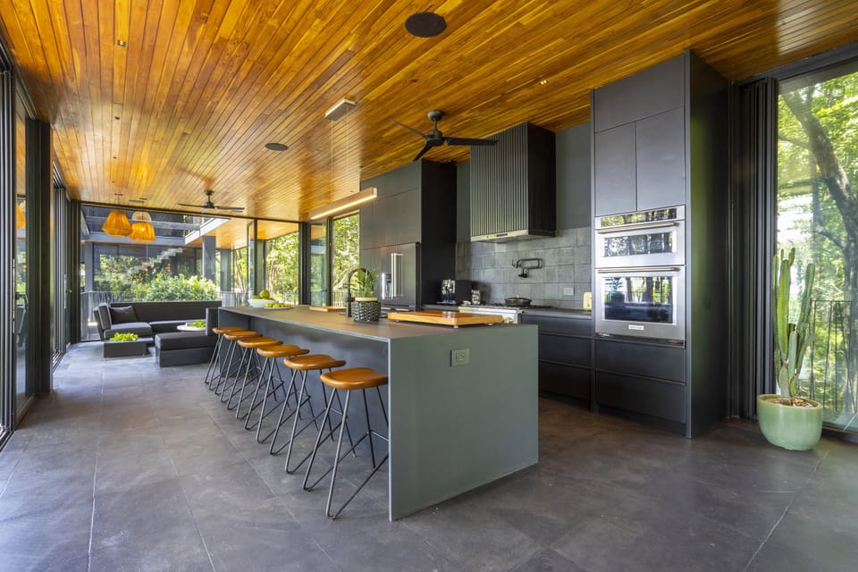 Big kitchen island and the indoor living room. This entire space has ocean views