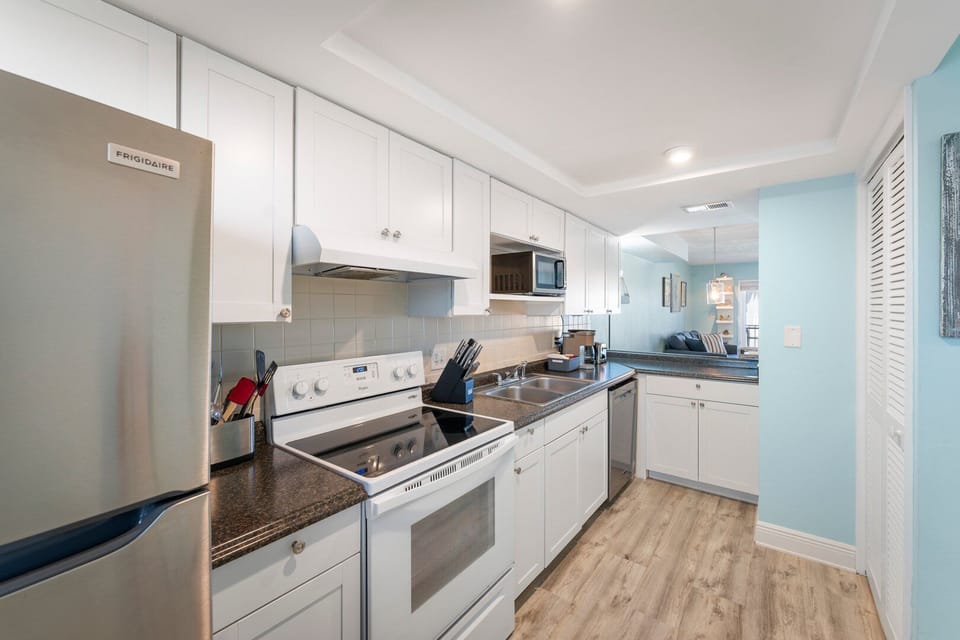 Kitchen area with ample cabinetry and space to cook your meal