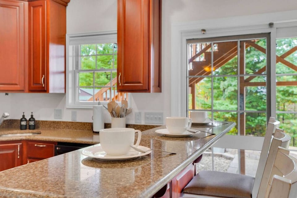 Kitchen has a bar area with additional seating for 3.