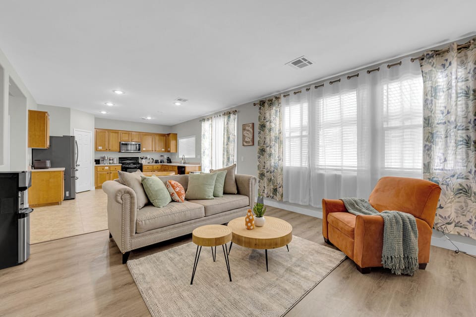 1st Floor family room with cozy sofa, chair & smart TV