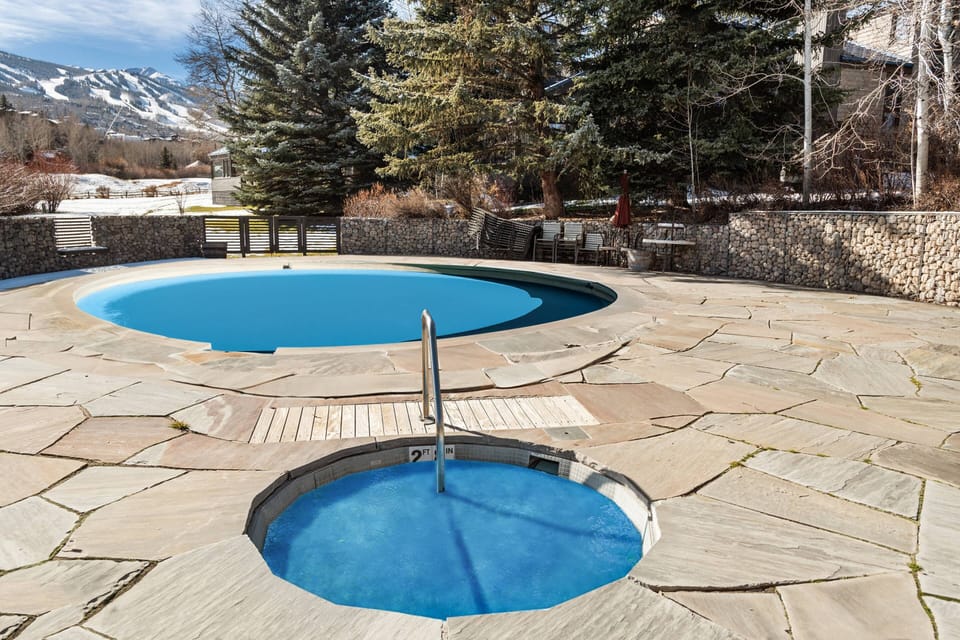 The hot tub is open during the winter & summer seasons with a great view of the ski area and is just steps from your vacation rental.  Pool is summer