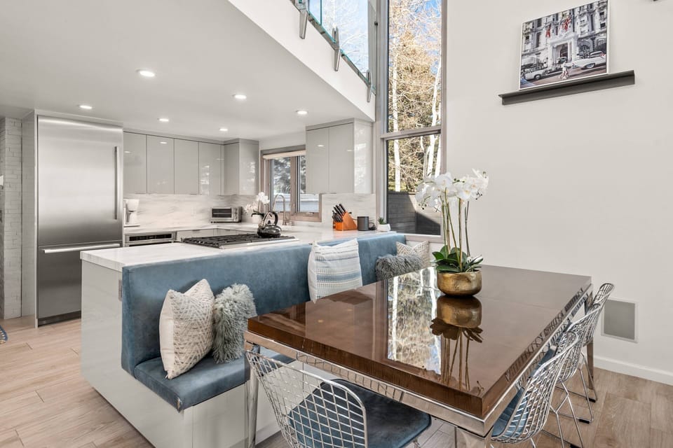 A large dining table with seating for 8 and a dedicated bar and wine fridge make entertaining easy!