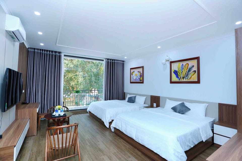 Deluxe Quadruple Room | Down comforters, memory foam beds, individually furnished, desk
