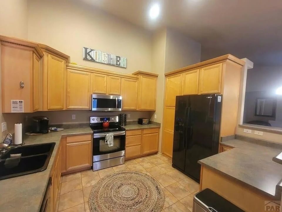 Kitchen with two types of coffee makers.
Drip style and Keurig.