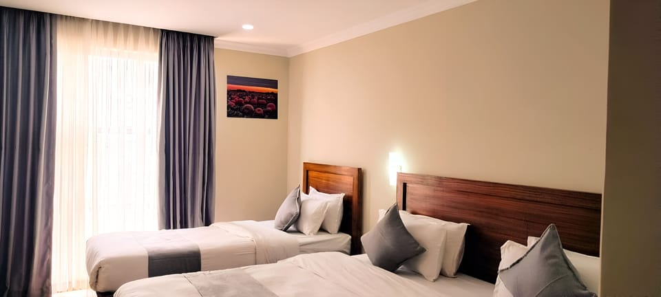 Premium bedding, memory foam beds, minibar, desk