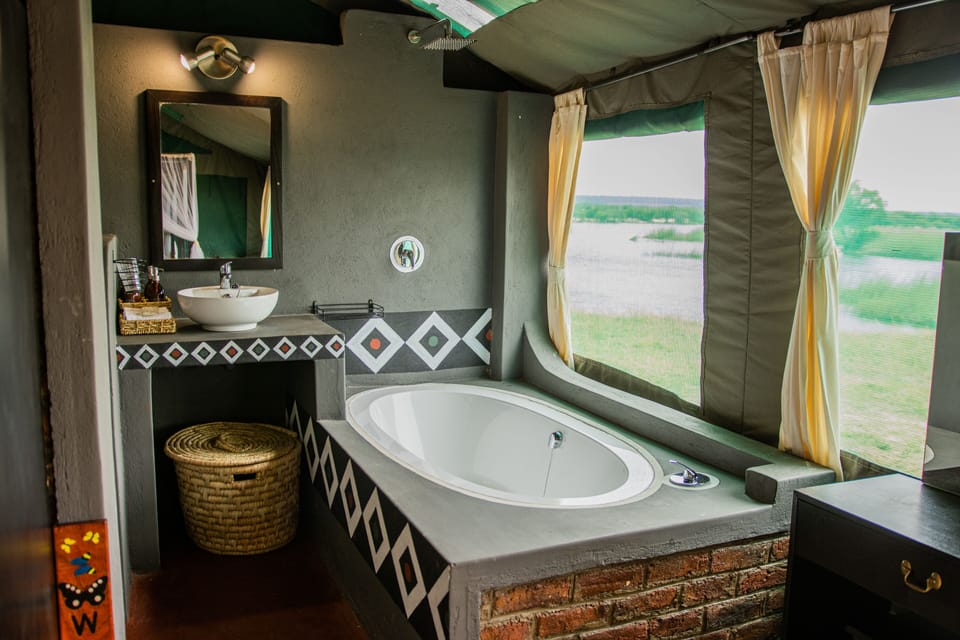 Shower, rainfall showerhead, eco-friendly toiletries, towels