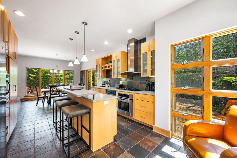 Fully stocked with stainless steel appliances, the kitchen has everything you need