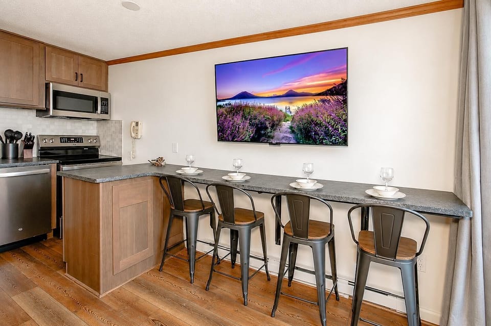Gather around the dining nook, where four Guests can enjoy meals comfortably together.