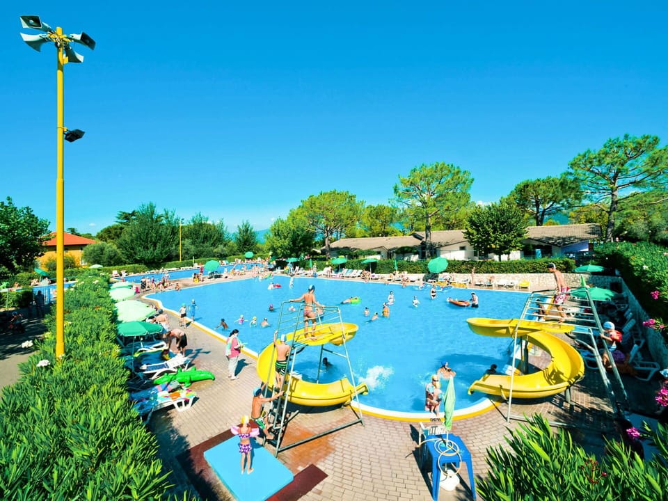 Water, Sky, Street Light, Plant, Swimming Pool, Tree, Urban Design, Outdoor Recreation, Grass, Leisure