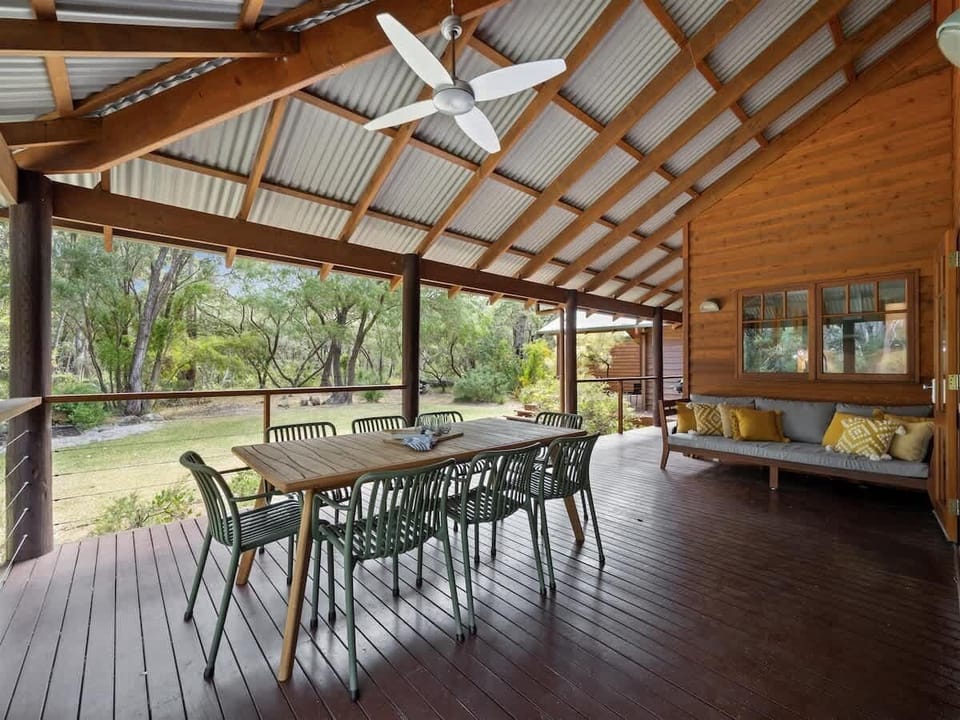  Enjoy the fresh air on the covered deck, complete with a Webber BBQ, outdoor dining area, and peaceful bushland views.