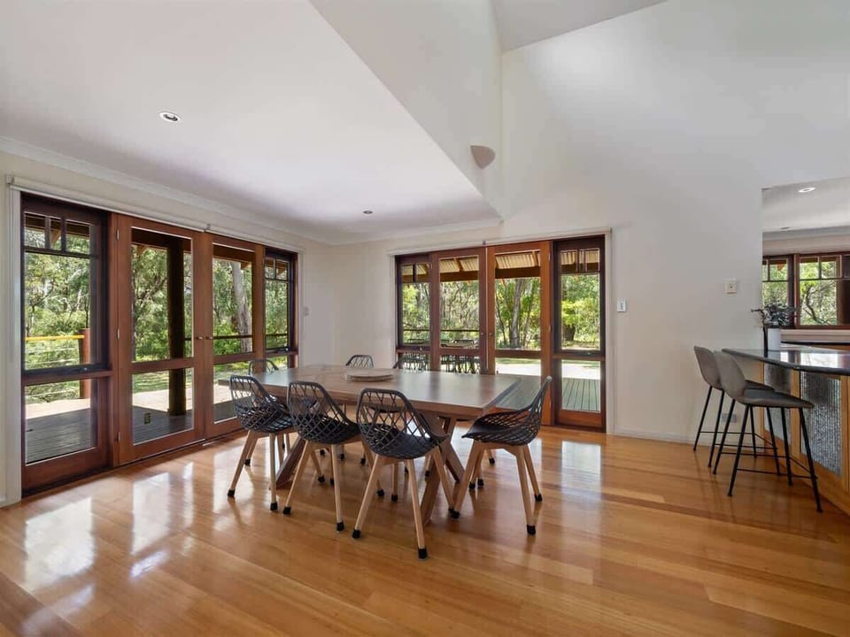Gather around the dining table with garden views and plenty of natural light, or step outside for alfresco meals on the deck.